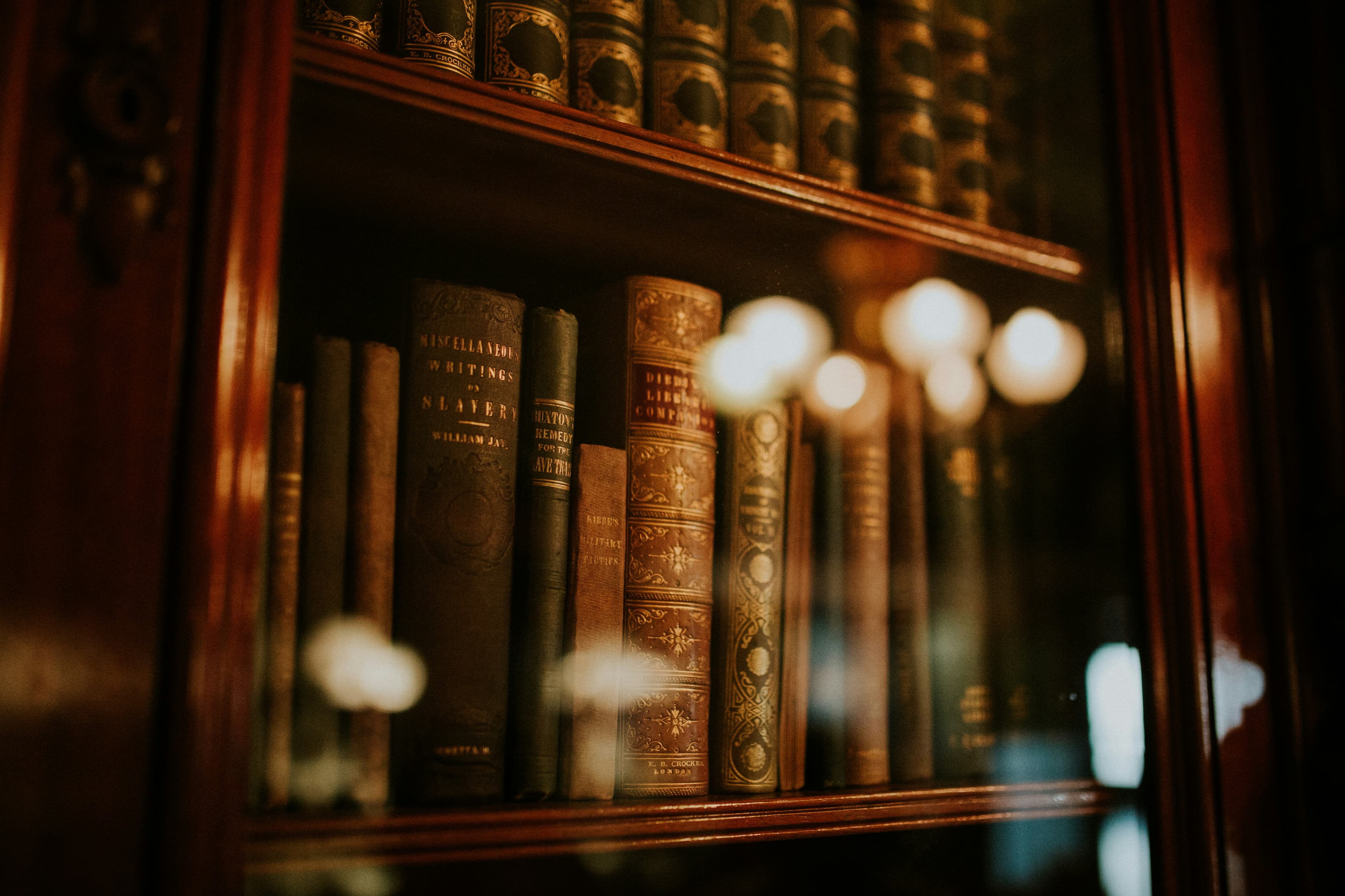 Rows of legal volumes behind a glass-fronted bookcase